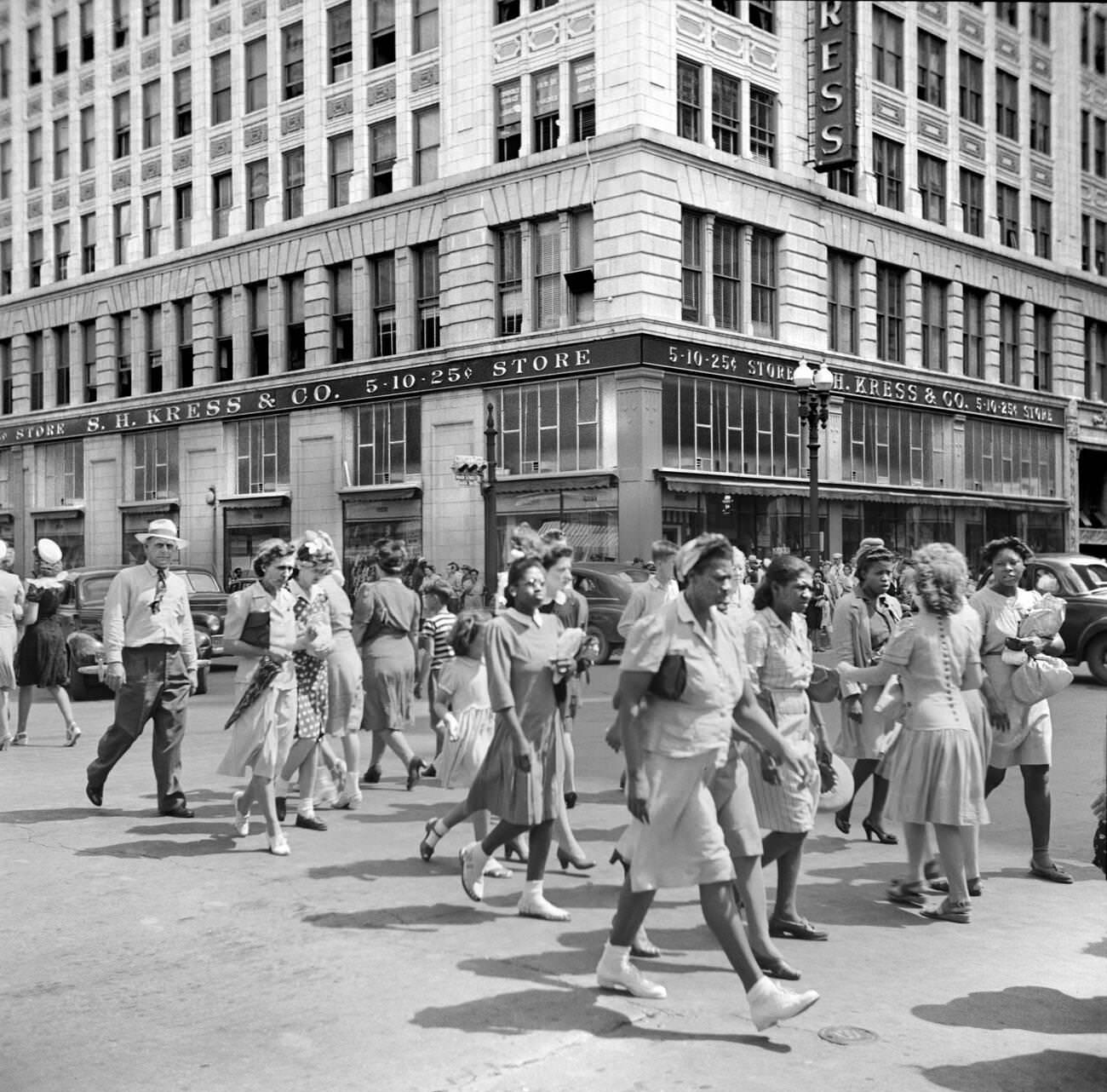 #61 Crowd of pedestrians on a downtown street in Houston, Texas, 1943.