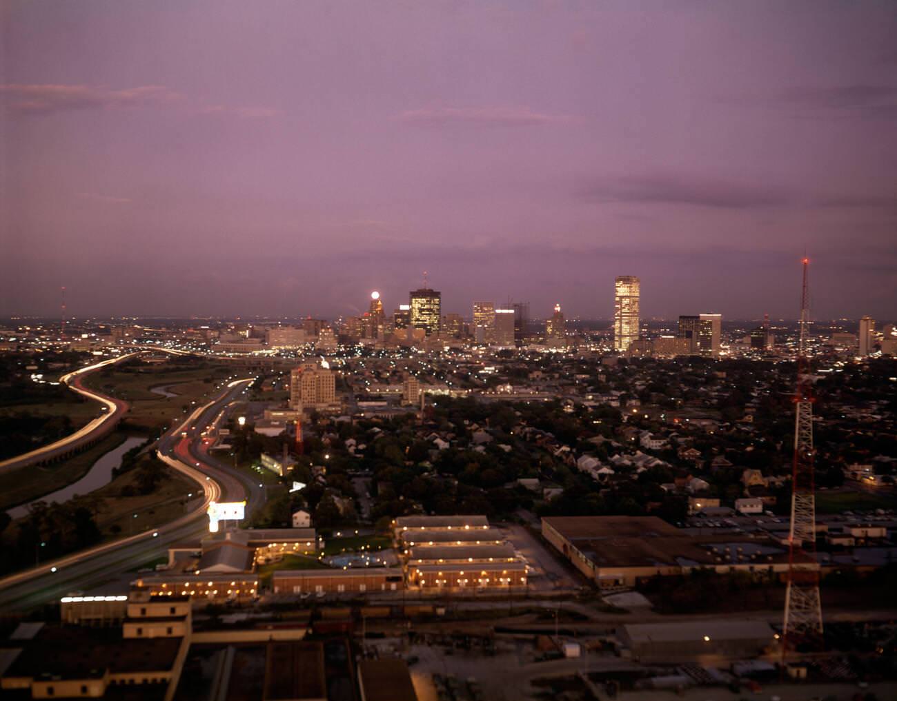 #26 Elevated view of Houston’s skyline at twilight, showcasing urban sprawl, 1960.