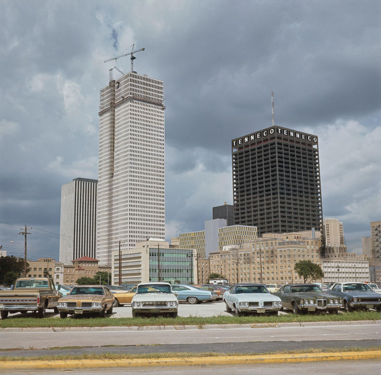 #30 Skyscrapers including the Tenneco Building rise above a downtown Houston parking lot, Texas, circa 1970.