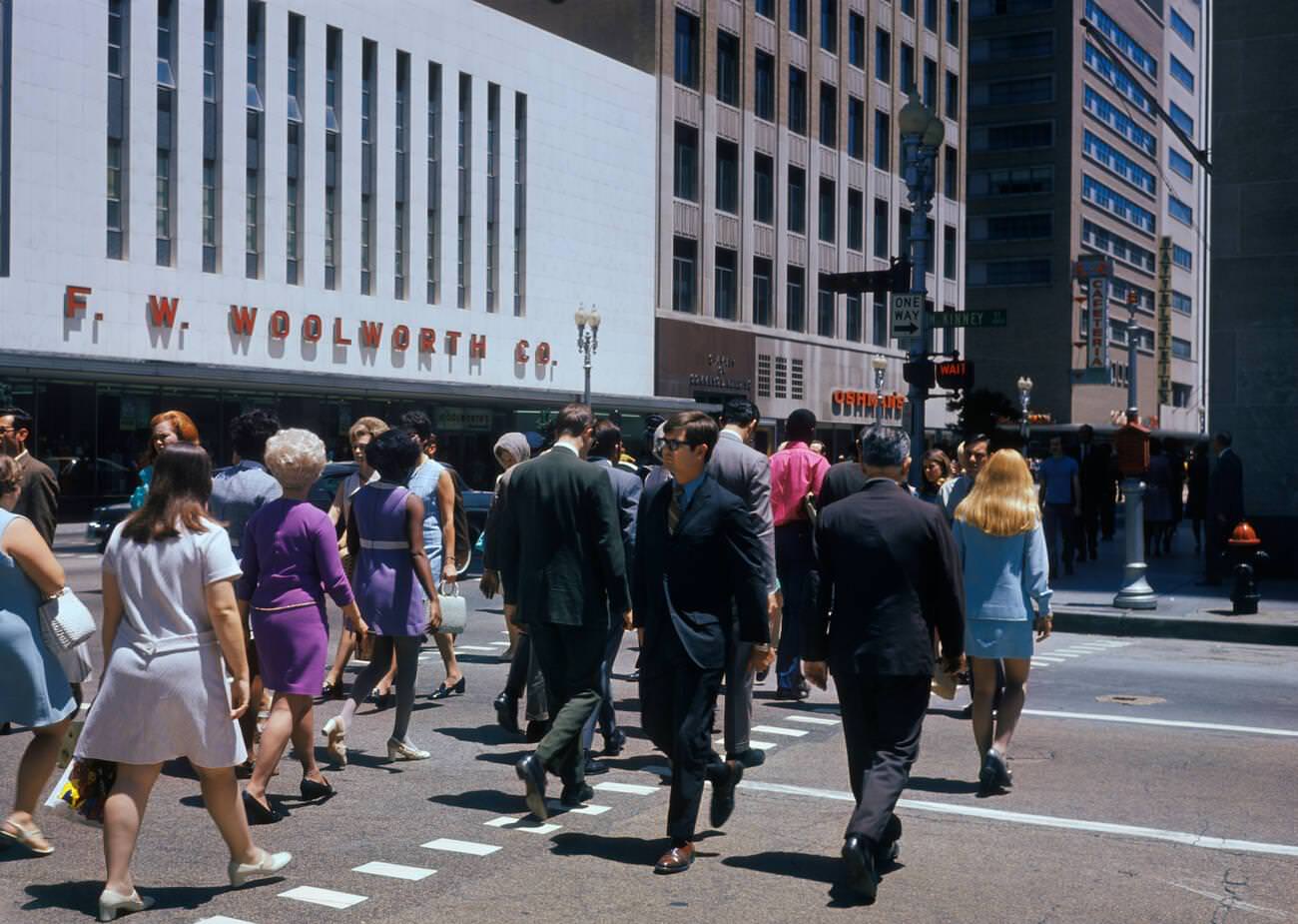 #66 Crowd crossing McKinney Street at Main Street in Houston, Texas, 1970s.