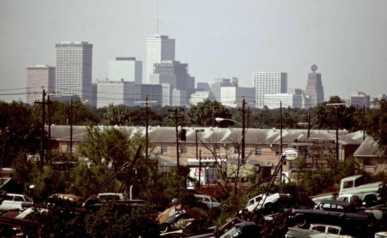 #44 Automobile junkyard with the Houston skyline in the background, 1973.