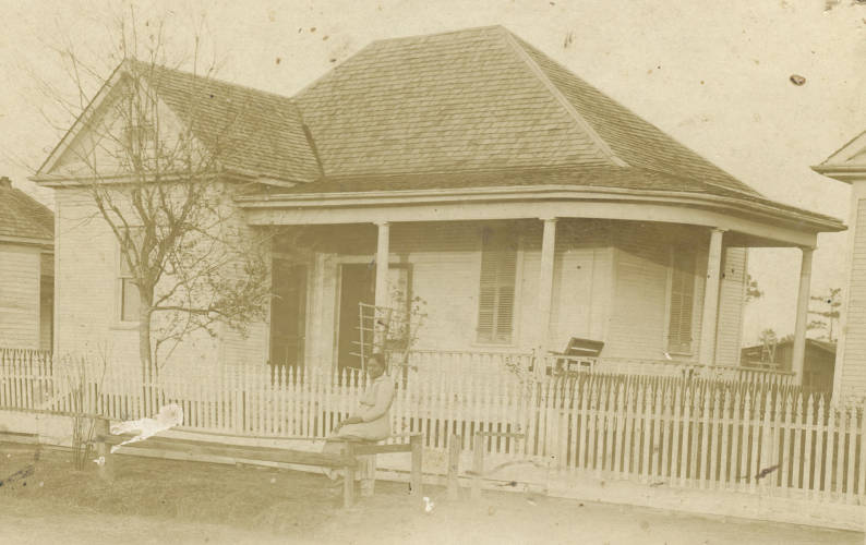 #21 Mrs. Johnson outside her property, Houston, 1910.