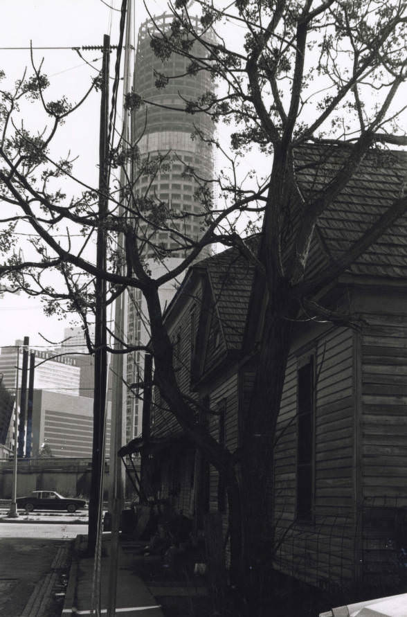 #9 View of Houston from street with wood buildings, 1960s
