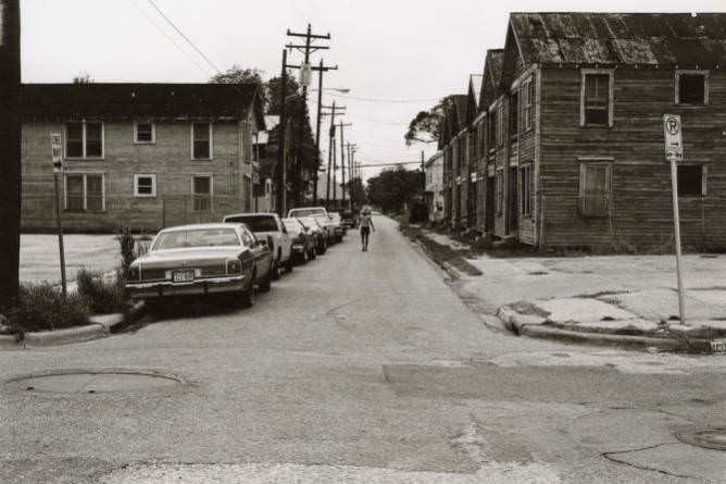 #22 Person walking down street, 1970s