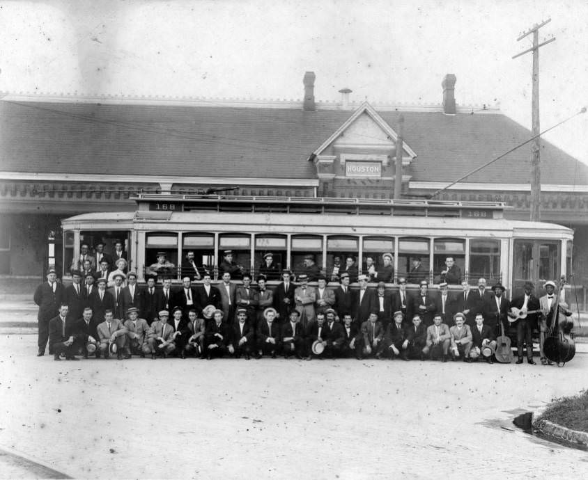 #33 Group of men posing in front of a streetcar, 1910s