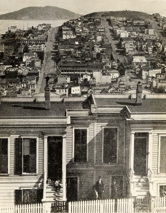 #67 Looking east from Russian Hill to Telegraph Hill & Yerba Buena Island, Lombard St. to the left, Columbus Ave. in the valley, 1877