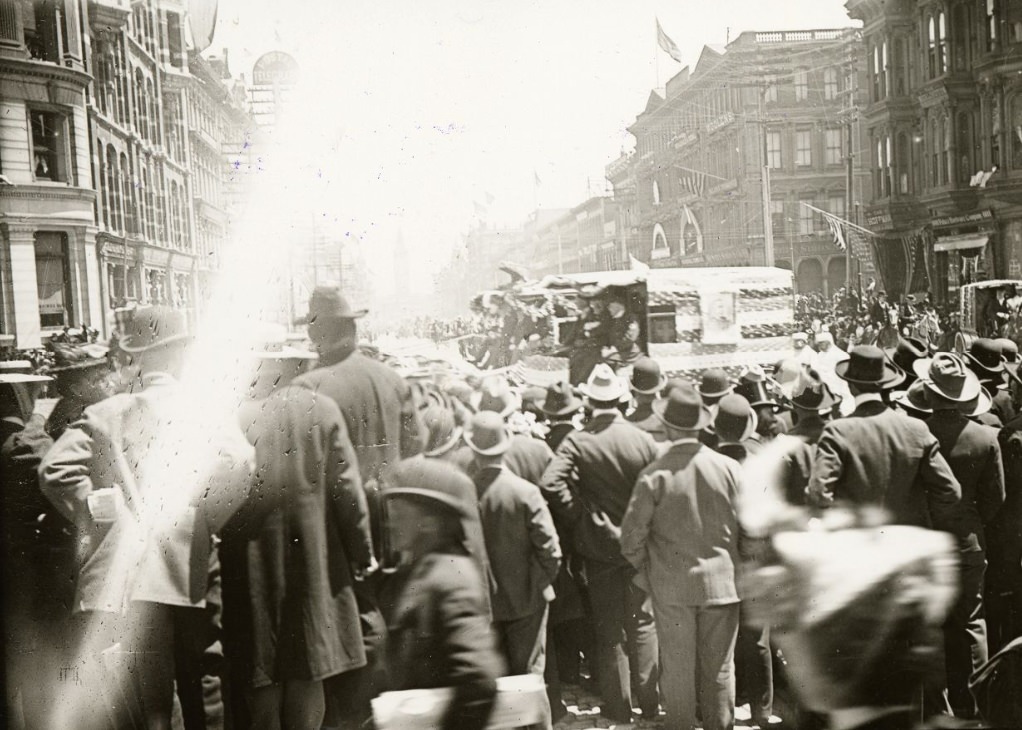 #62 Crowd of people watching a parade on Market Street, east of Montgomery, 1899