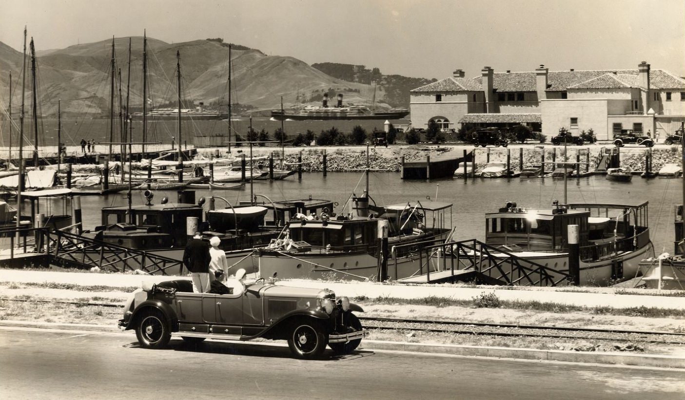 #211 Four people in a parked car at Marina Yacht Harbor, 1929