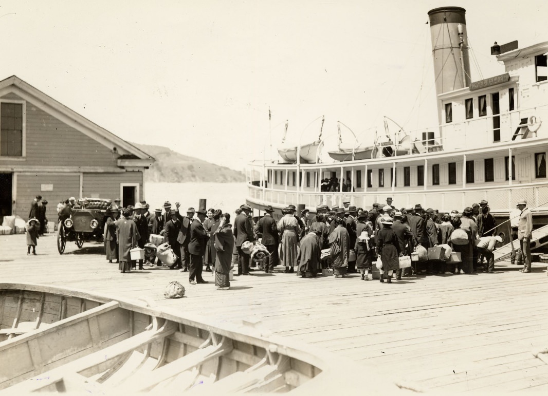 #65 Crowd of people on a dock at Angel Island in 1920.