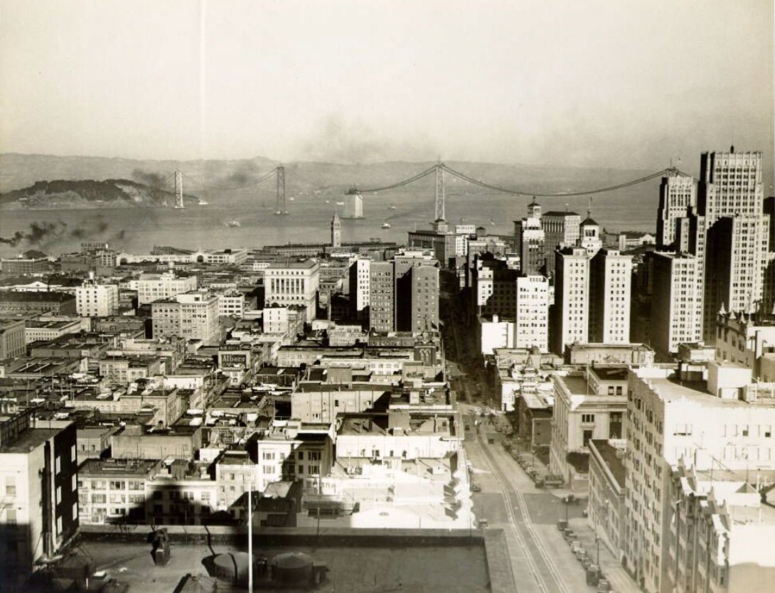 #120 View of downtown with Bay Bridge under construction in the 1930s