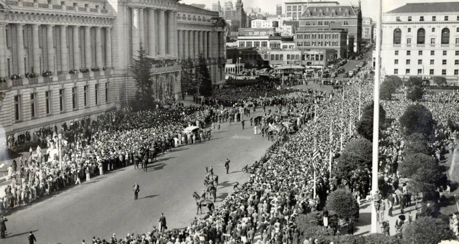 #182 Large crowd of people gathering in front of City Hall in the Civic Center, 1932