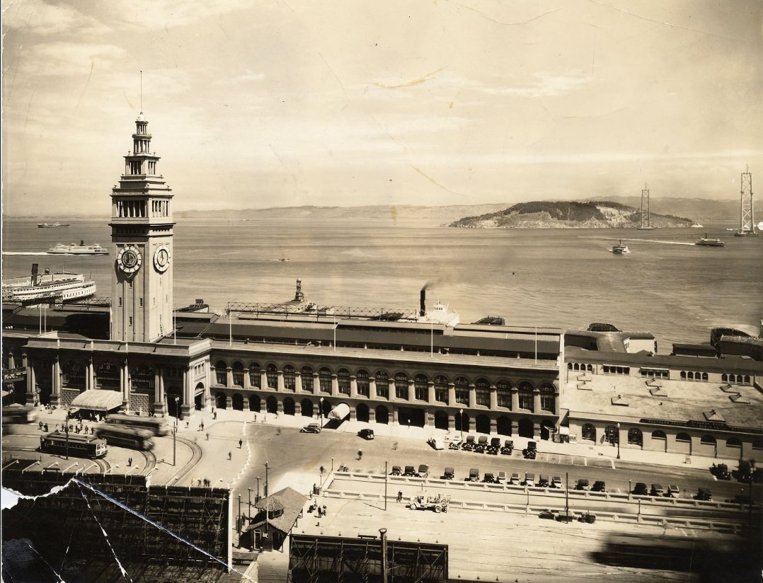 #53 View of Ferry Building with Bay Bridge under construction in the background, 1935