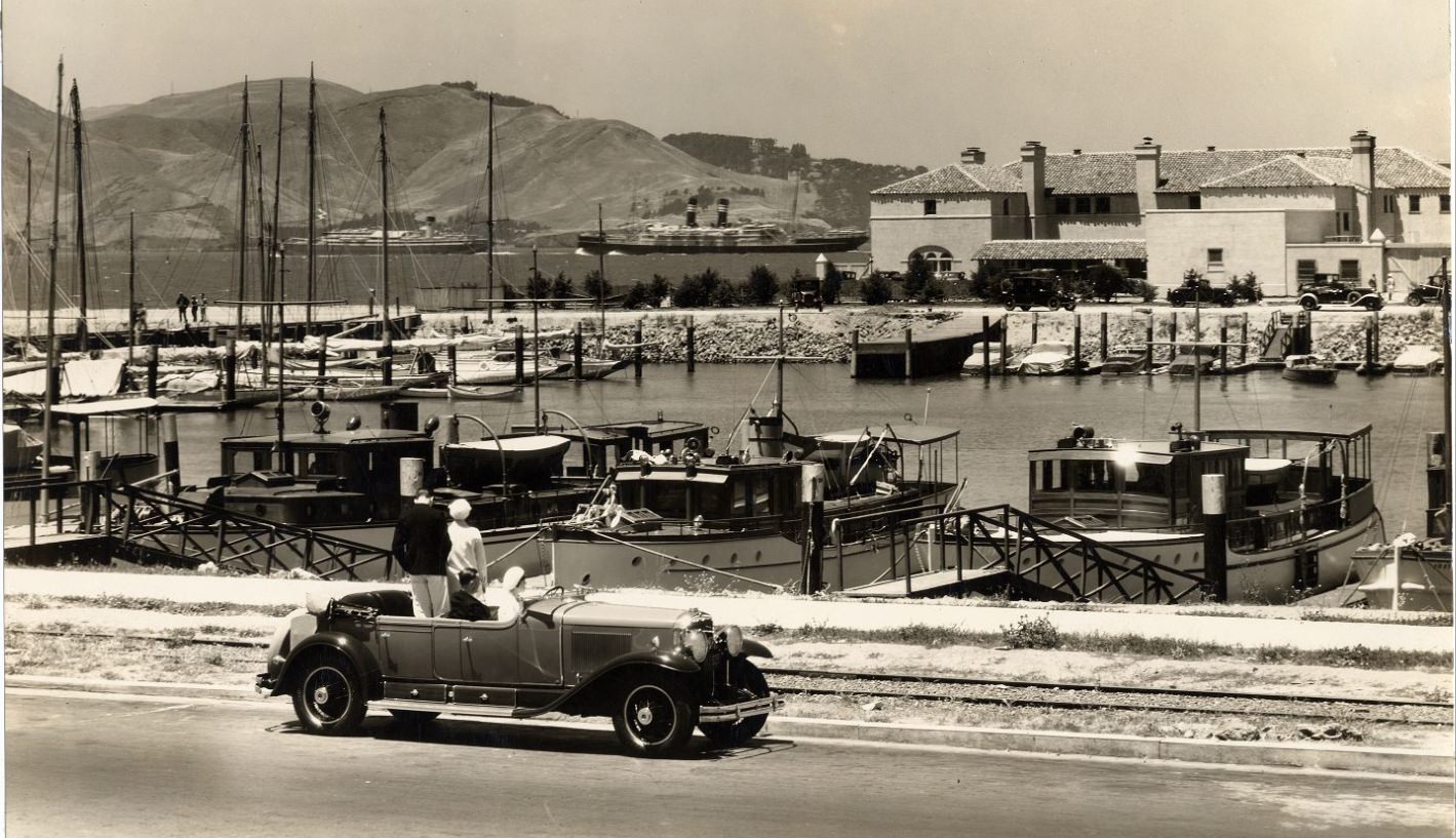 #46 Four people in a parked car at Marina Yacht Harbor between 1920 and 1939