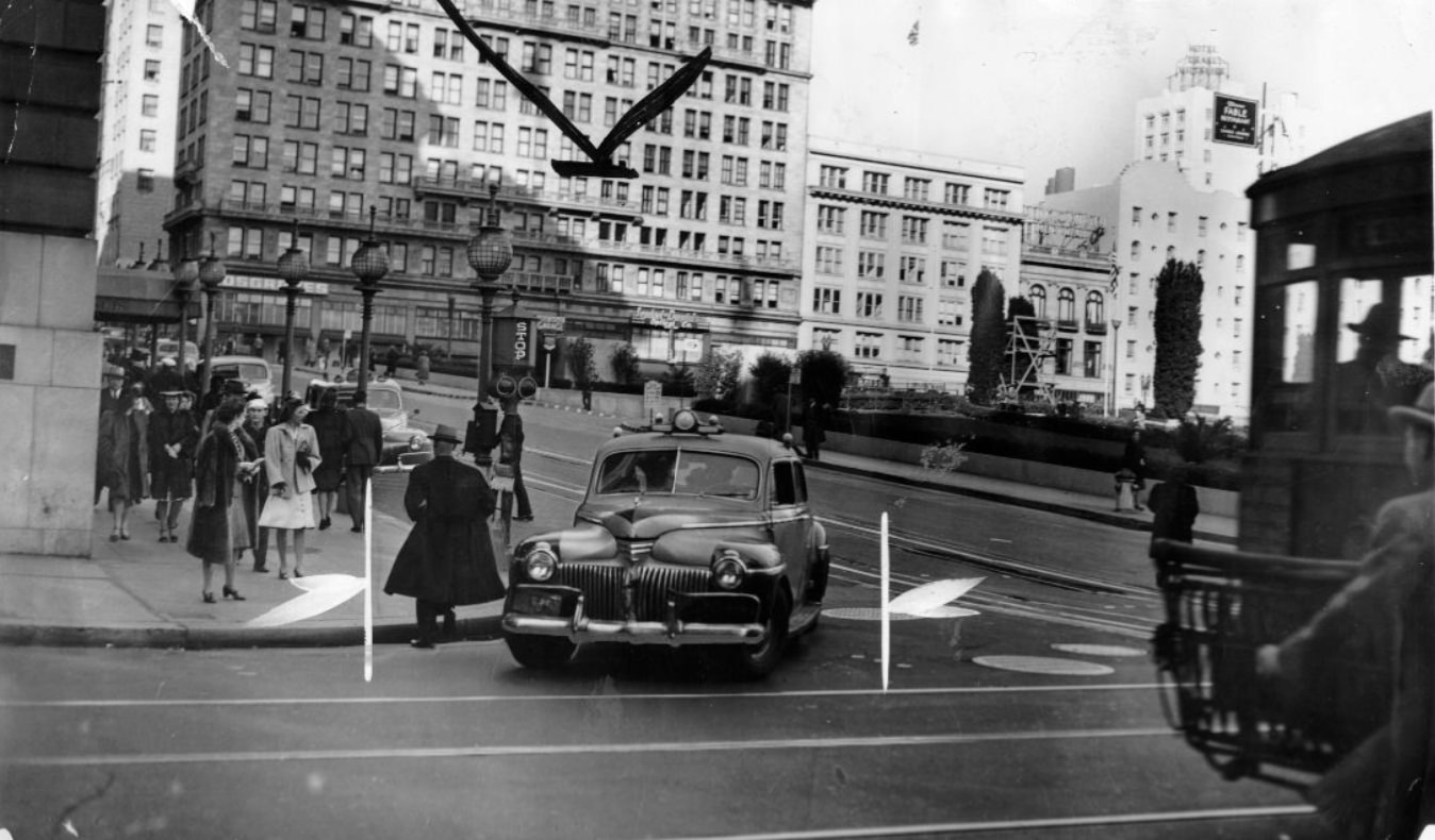 #131 Automobile turning onto Powell Street from Geary, 1944