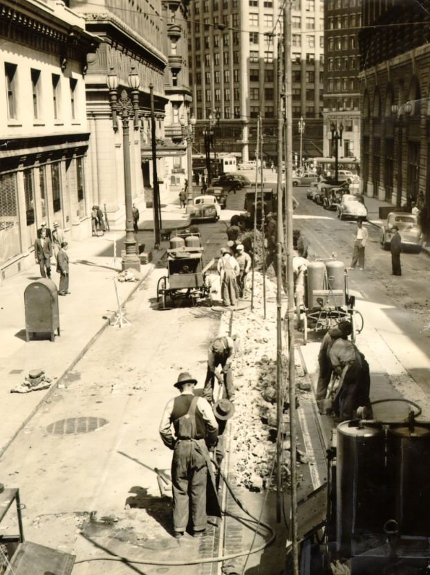 #144 Market Street Railway crew removing long-unused tracks, 1940