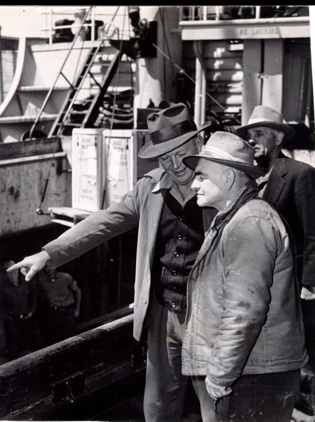 #154 Chester (Pop) Hardister discusses loading operations with Bill Huschens, 1950