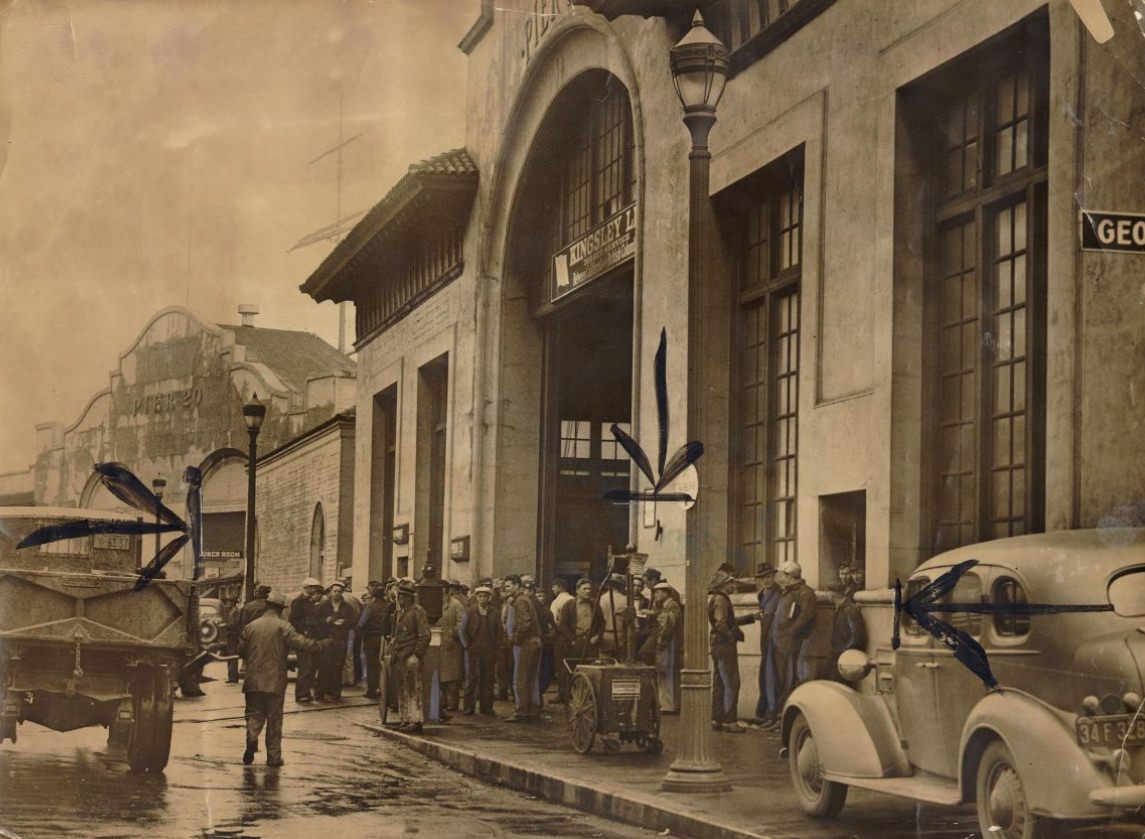 #173 Workmen refusing to work in front of a pier protesting a no smoking order, 1943