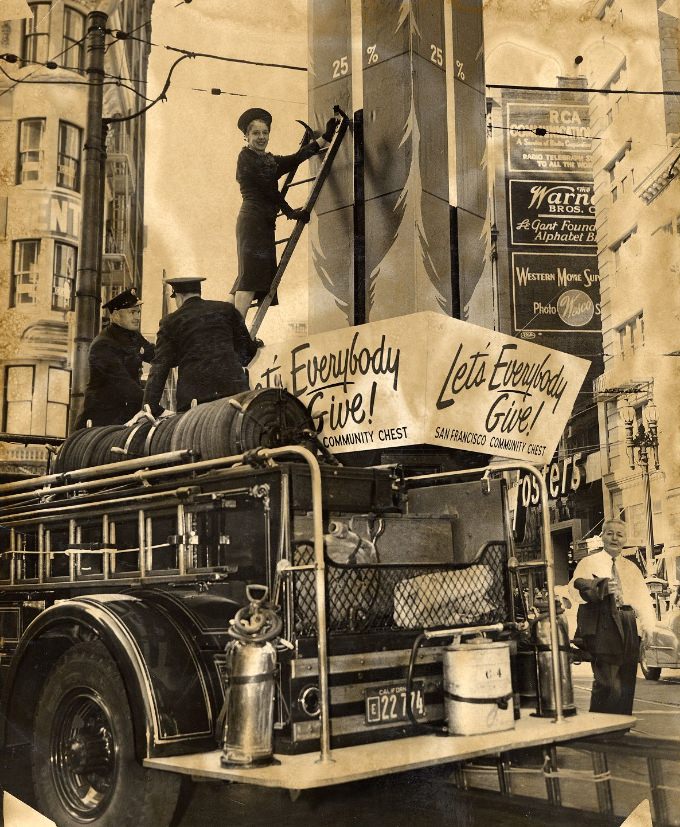 #258 Fireman George Harper and Lieutenant Michael Switzer with Mrs. Edmund J. Morrissey at Lotta’s Fountain, 1947