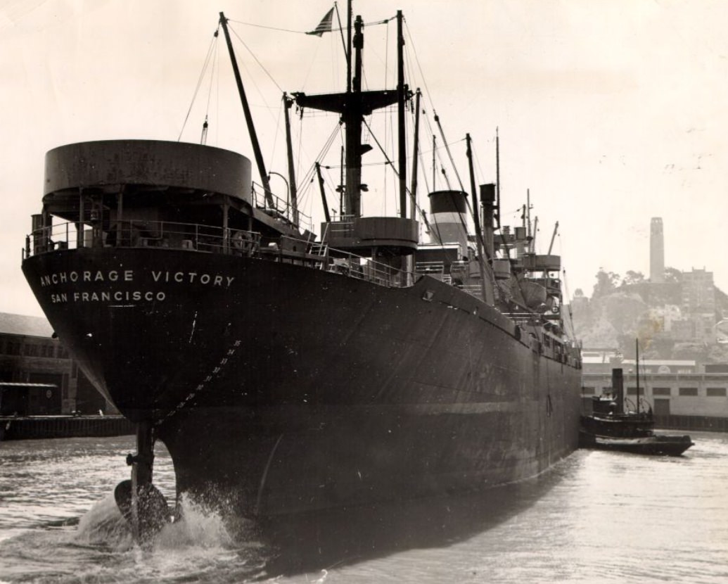 #104 Tug boat pushing the S.S. Anchorage Victory at a San Francisco pier, 1946