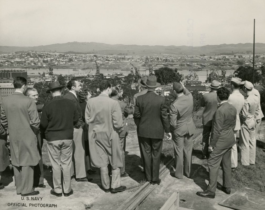 #126 Press members overlooking Hunters Point from a hilltop, 1945