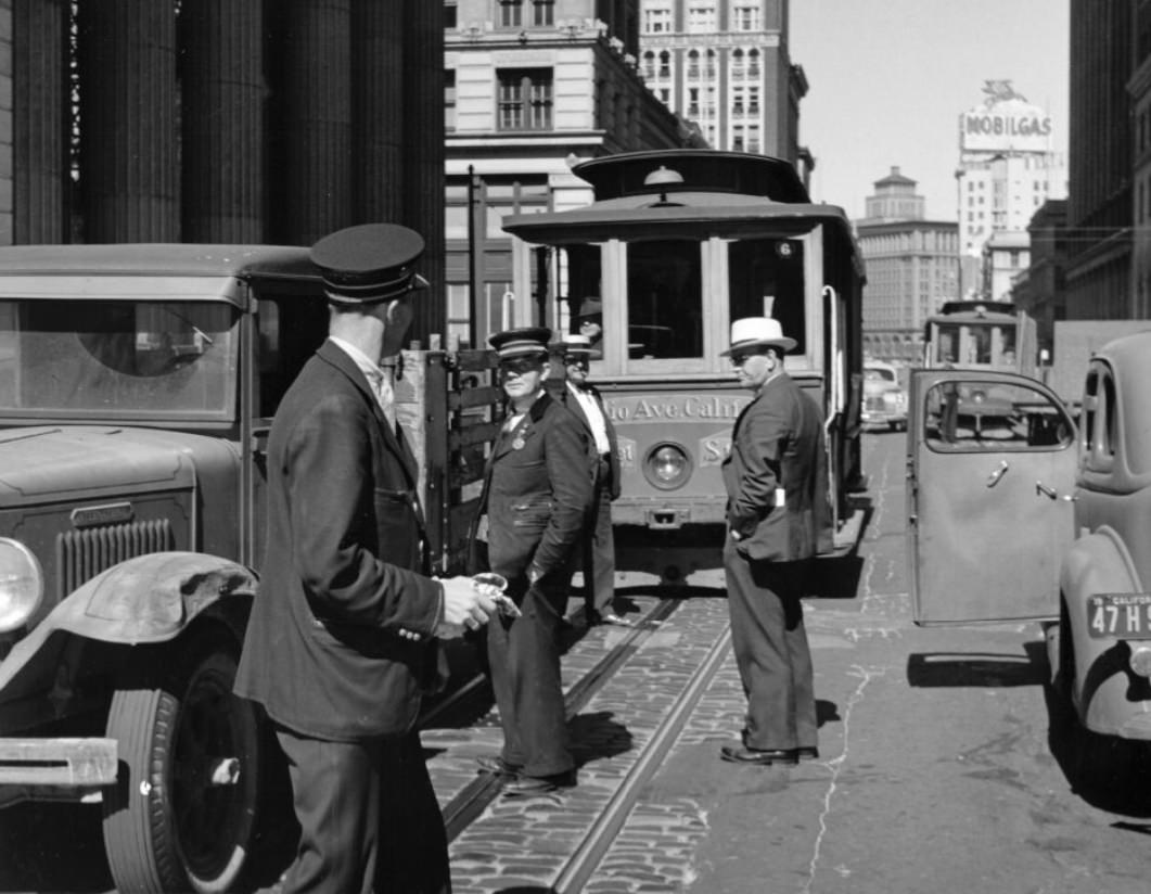 #193 Men in front of a cable car on California Street, 1940s