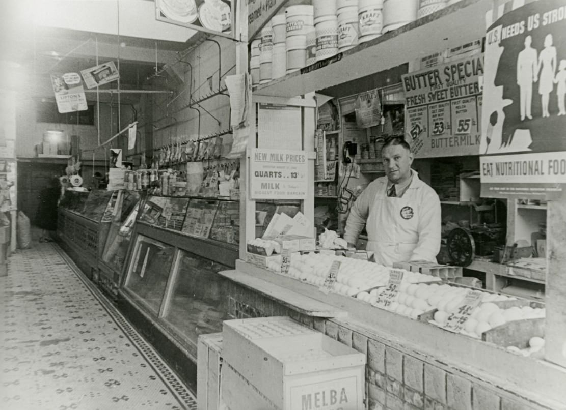 #232 Owner George working at Eagle Market on Fillmore Street, 1940s