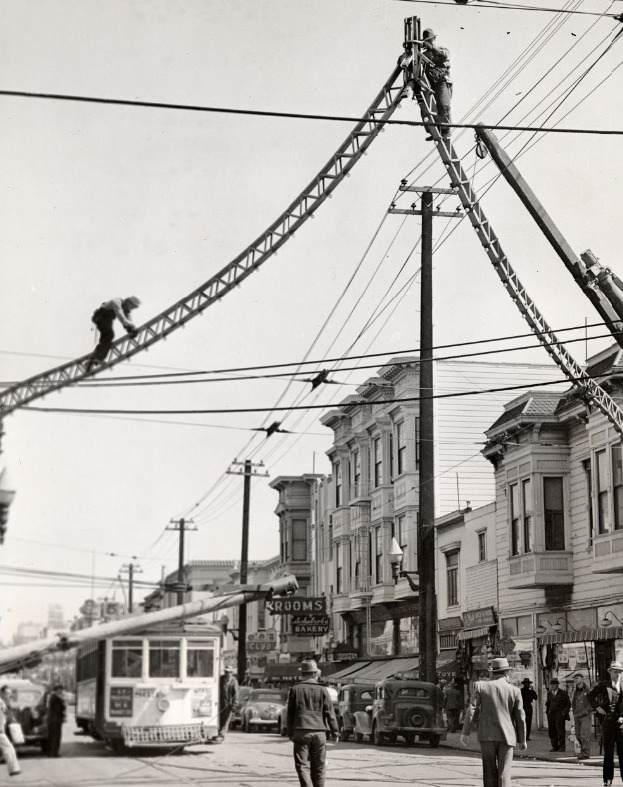 #14 Metal arches on Fillmore Street being dismantled for scrap metal, 1943