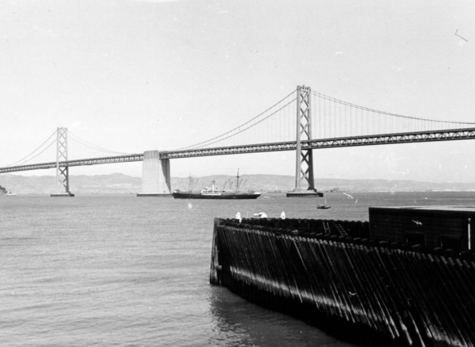 #91 View of the Bay Bridge from a San Francisco pier, 1940s