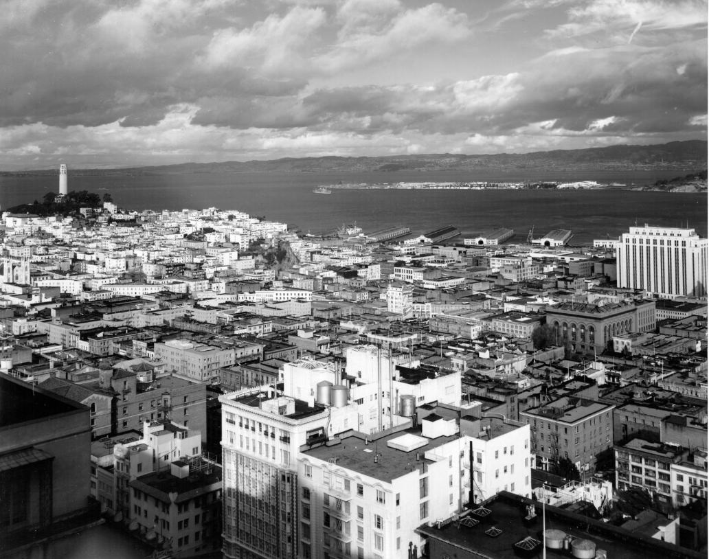 #98 View of downtown San Francisco with Coit Tower on the left and Treasure Island in the distance, 1953.