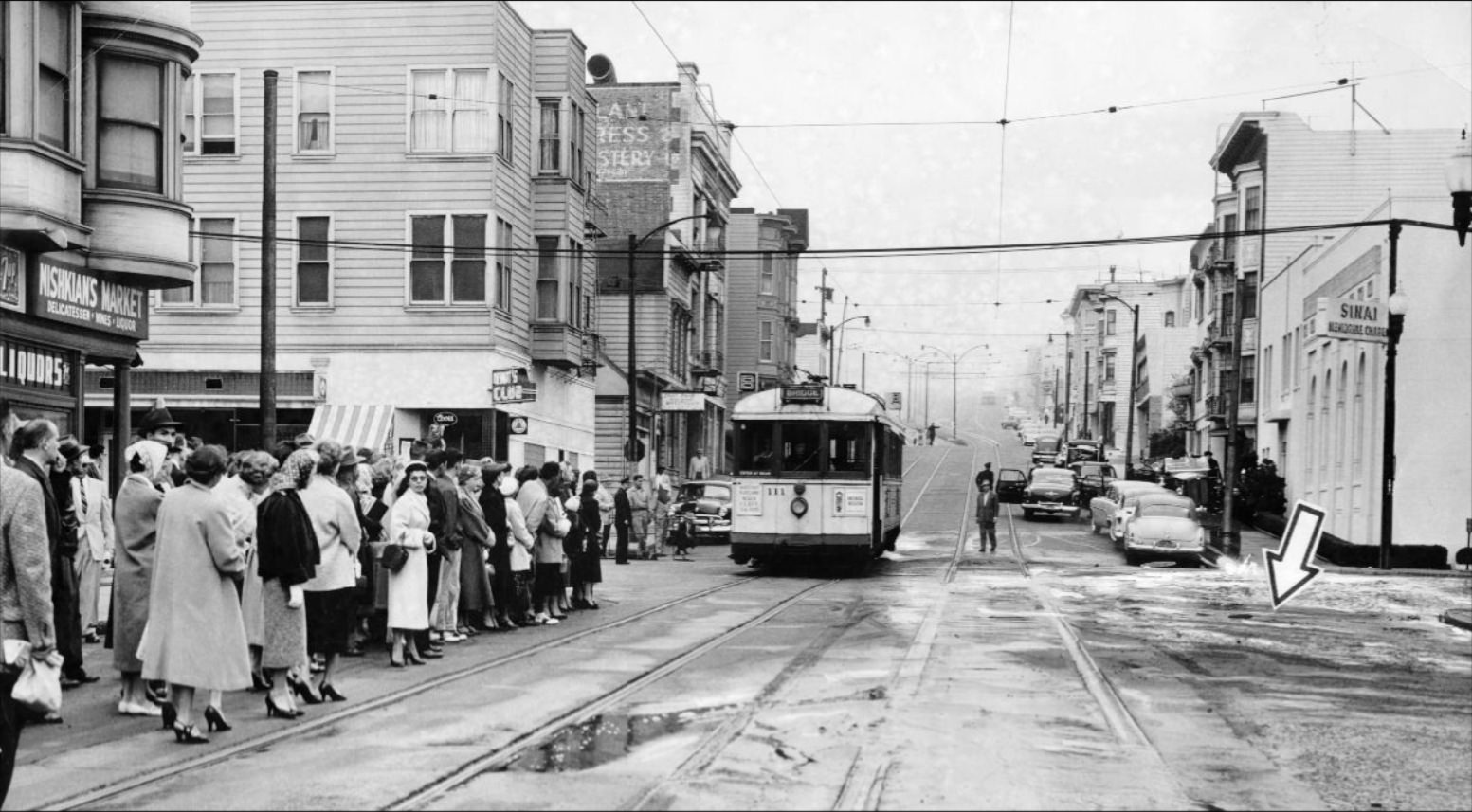 #116 Site of a water main break at Geary and Divisadero, 1956.