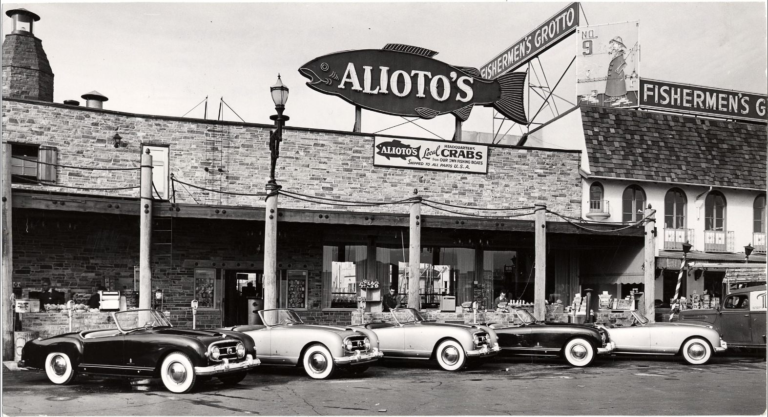 #230 Nash-Healeys parked outside Alioto’s restaurant in Fisherman’s Wharf, 1953.