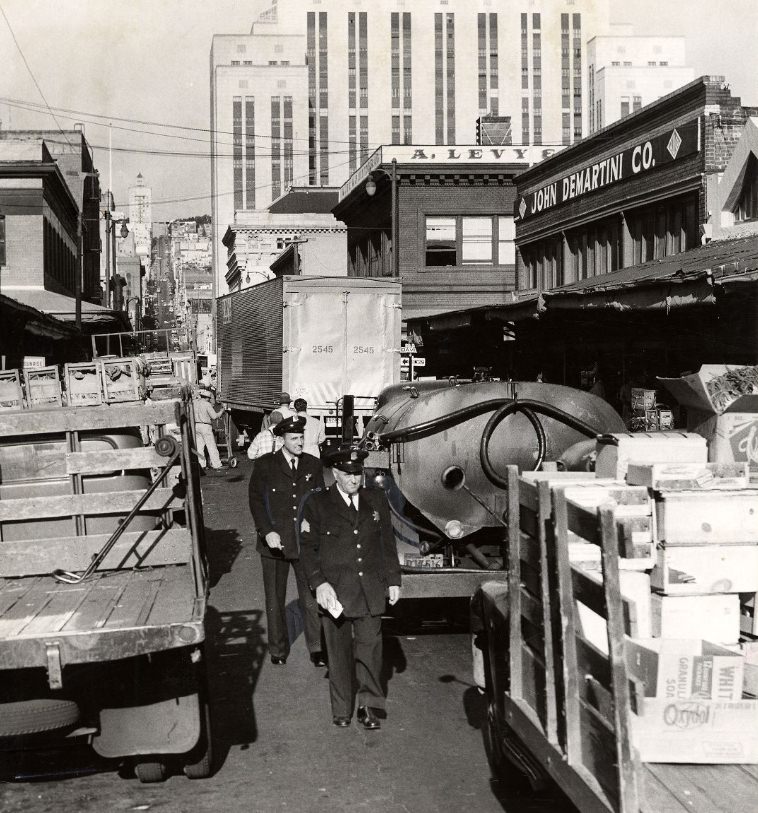 #34 Police issuing tickets to delivery trucks on Washington Street, 1956.
