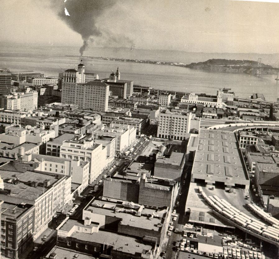 #95 View of downtown San Francisco with Treasure Island and Yerba Buena Island in the distance, 1964.