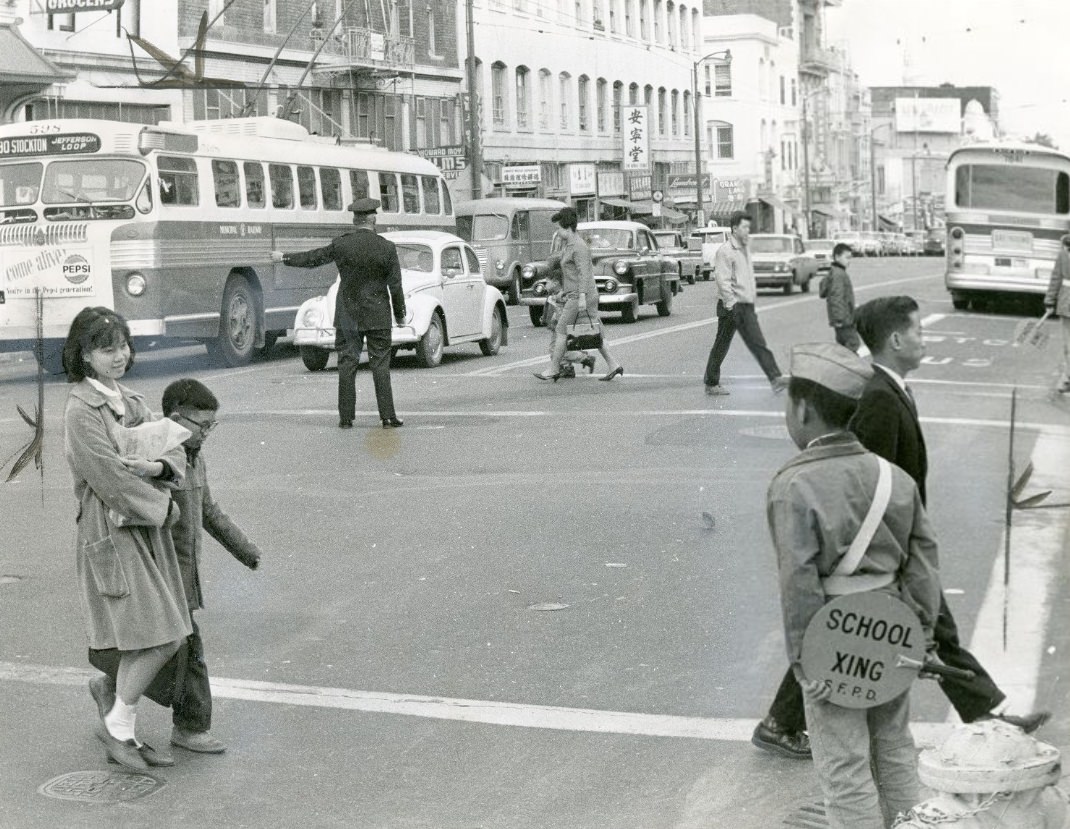 #102 Policeman directing traffic at Washington and Stockton streets, 1965.