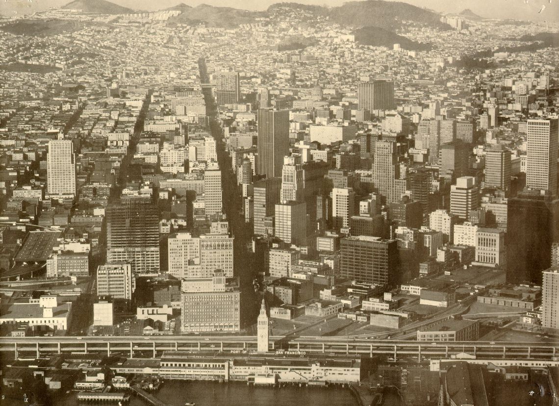#39 Aerial view of San Francisco from over the bay, looking west up Market Street, 1960s.