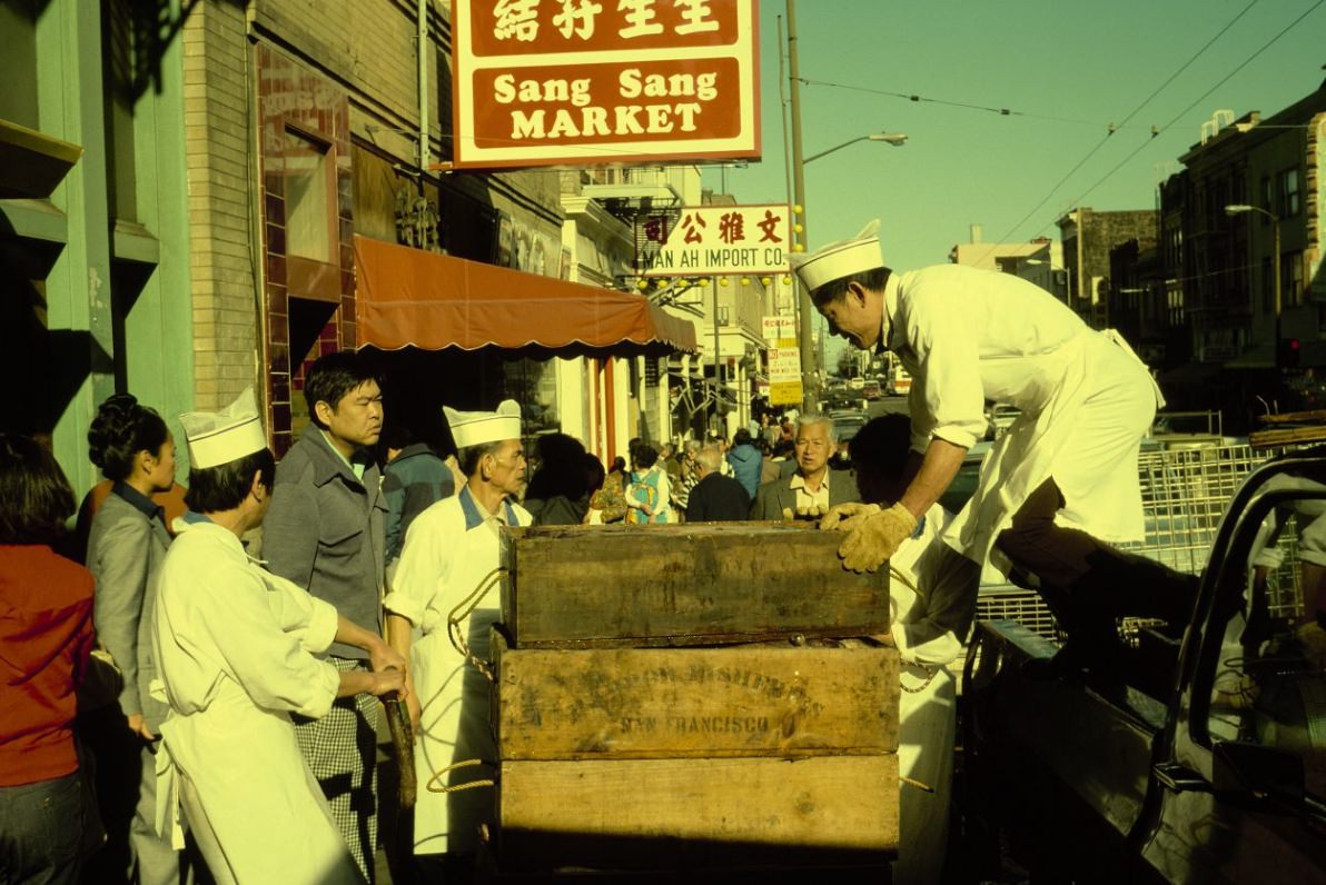 #109 Chinatown market receiving fish delivery on Stockton Street, 1978.