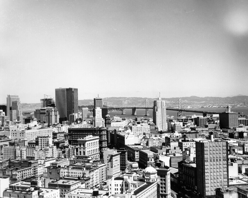 #154 Aerial view of San Francisco looking across downtown toward the Bay Bridge, 1970s.