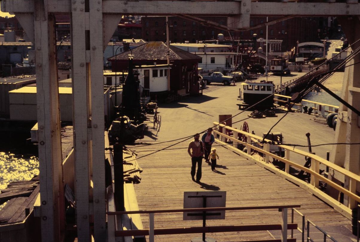 #95 People walking through Hyde Street Pier, 1984.