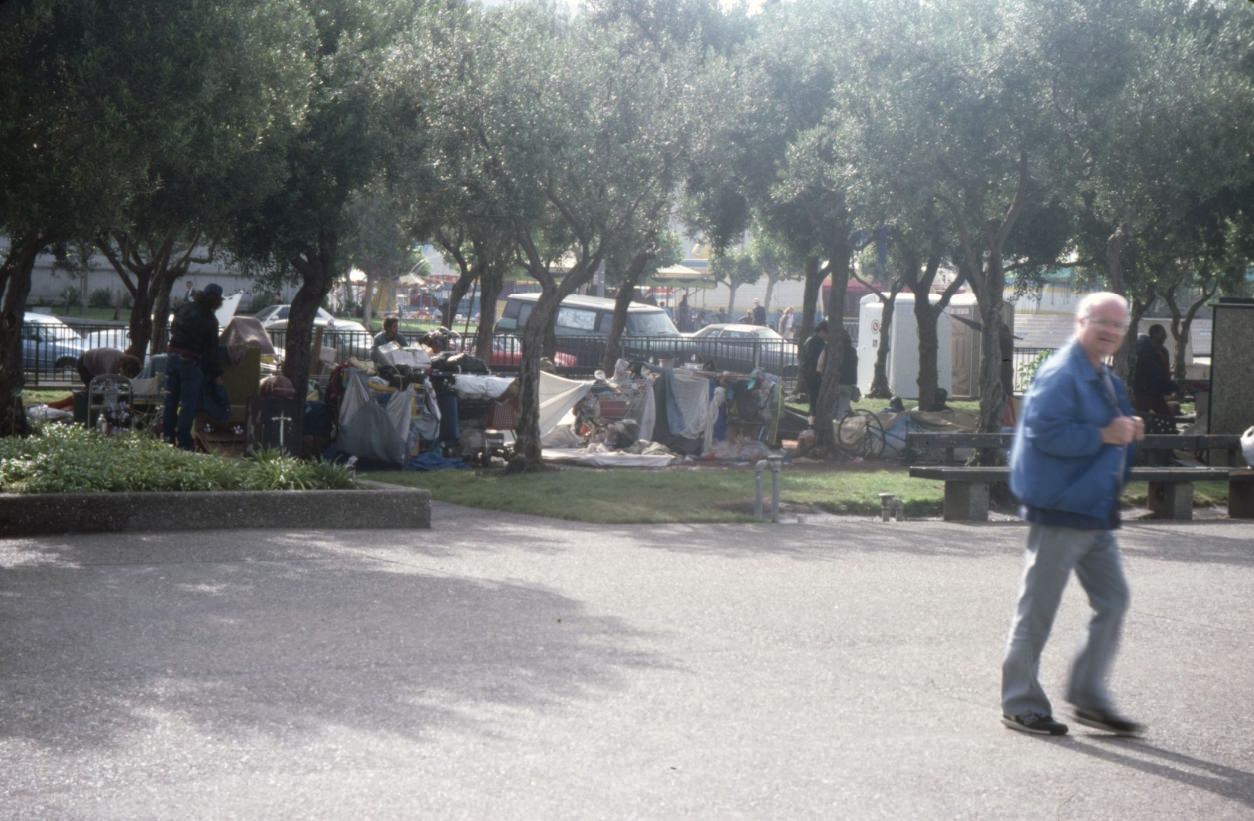 #54 Encampment of homeless people at Civic Center Plaza next to festival, 1989.