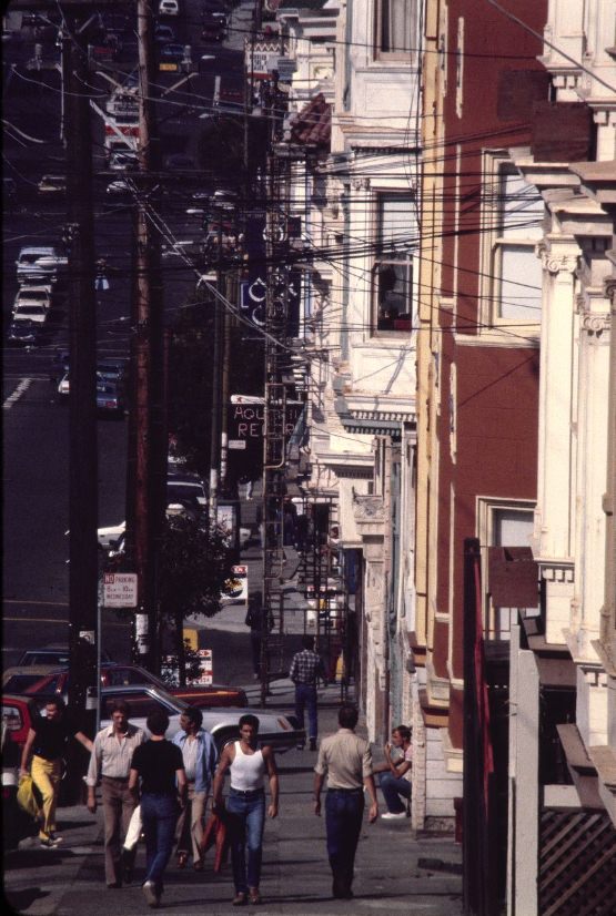 #75 People walking up and down a street, 1980.