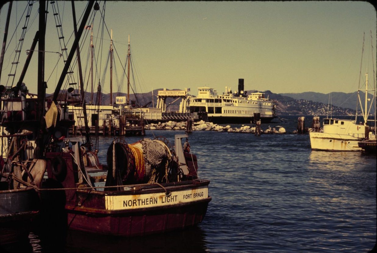 #91 Fishing boats and ferry docked at Fishermen’s Wharf, 1984.