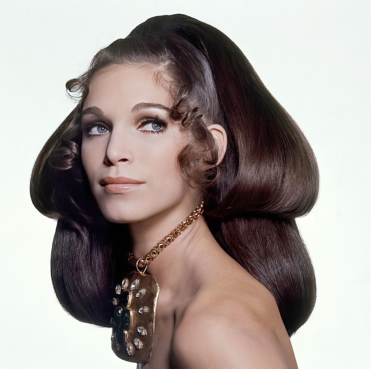 #27 Ann Turkel wearing a gold chain pendant by Madame Grès, 1969.