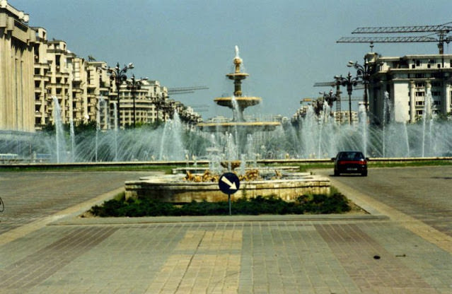 #4 Bulevardul Unirii with fountains and tower cranes in Bucharest, 1990s