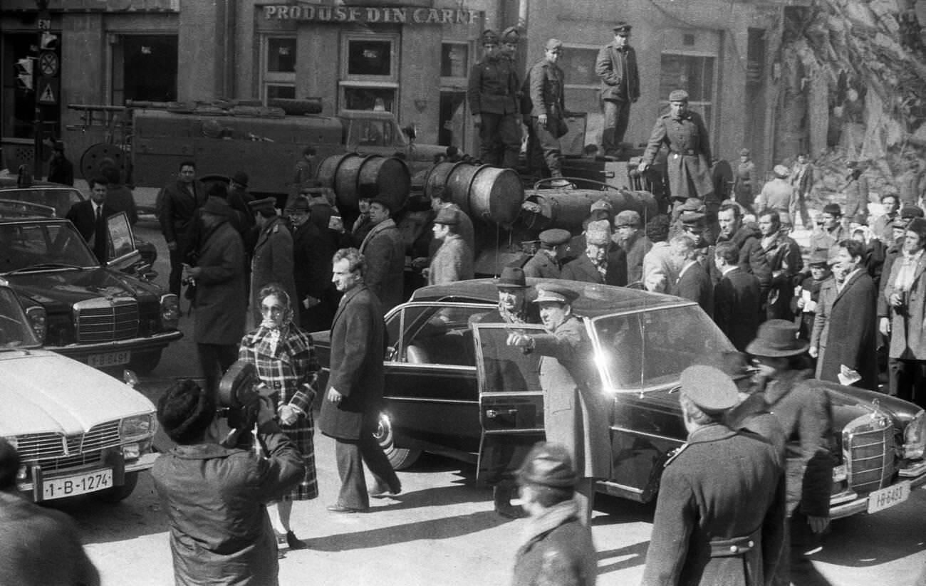 #19 Nicolae Ceausescu and officials viewing earthquake damage in Bucharest, Romania, March 1977.