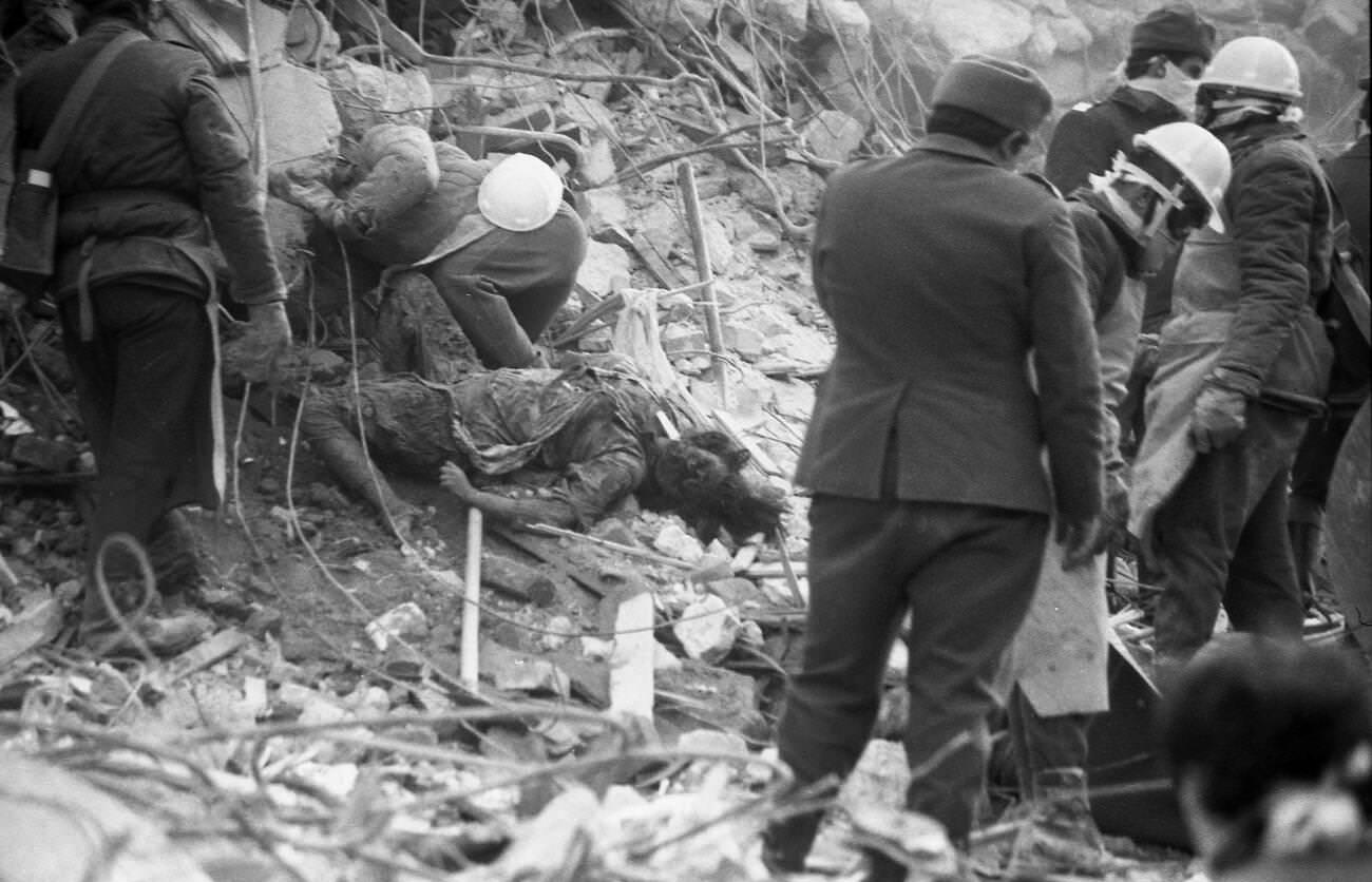 #22 Rescuers and victim after the deadly earthquake in Bucharest, Romania, March 1977.