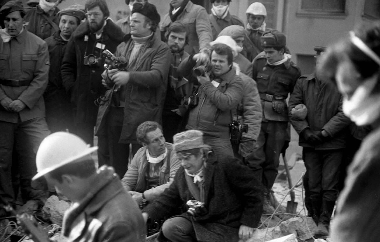#37 Journalists taking photos after the deadly earthquake in Bucharest, Romania, March 1977.