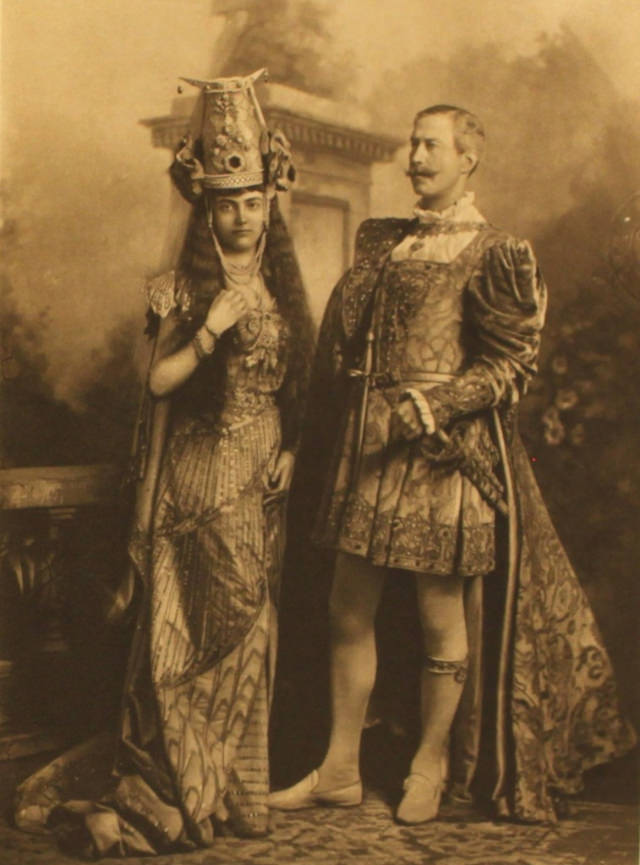 #40 Mrs Maguire as Dido, Queen of Carthage anachronistically accompanied not by a man dressed as Aeneas but by a Major Wynne-Finch, whose role is not recorded.