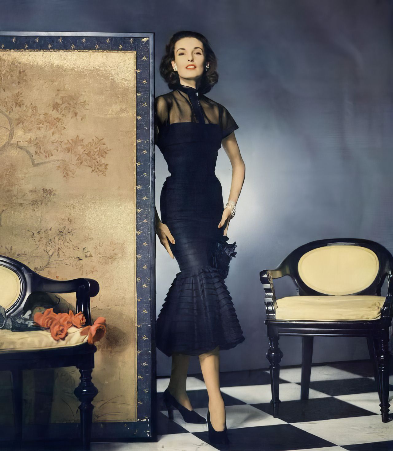 #6 Elise Daniels in a marquisette and Enka Rayon dress by Earl Luick for Anna Miller, Vogue, March 15, 1951.