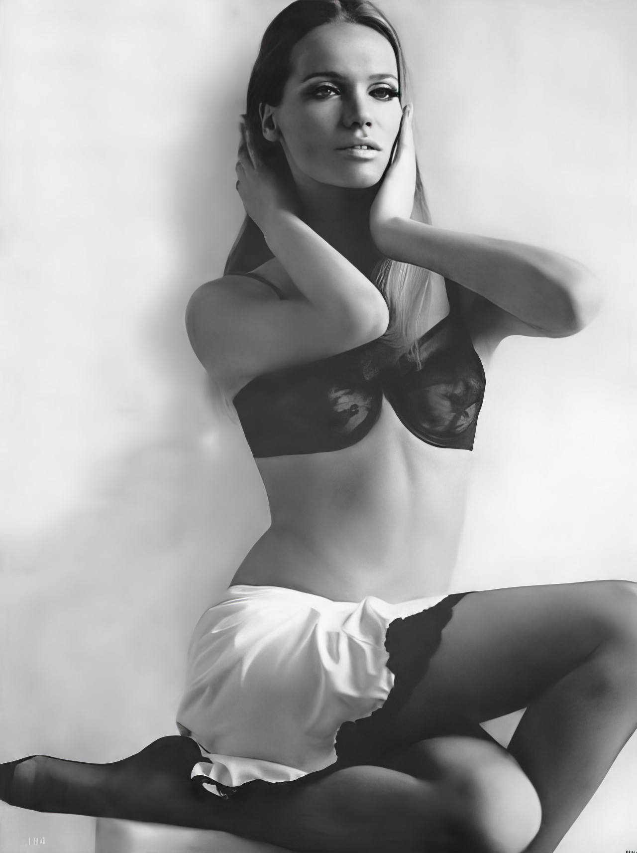 #9 Veruschka in a black lace bra and white slip by Maidenform and Kickernick, Vogue, March 1, 1966.