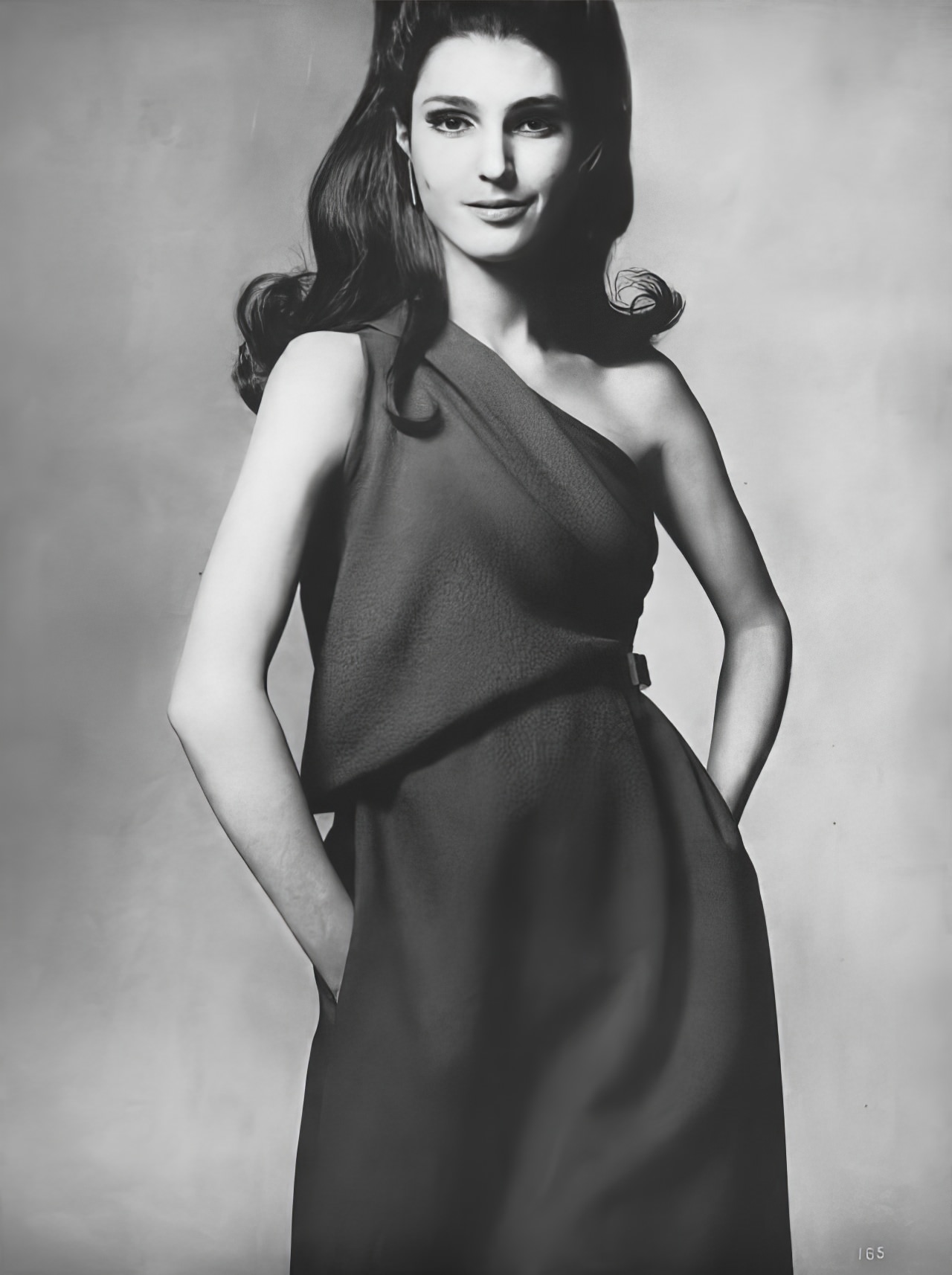 #13 Benedetta Barzini in a navy-blue jacquard dress by Galanos, Vogue, April 1, 1967.